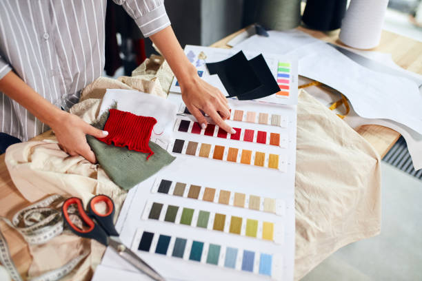 istock talented designer selecting colours for new garment 1176958603