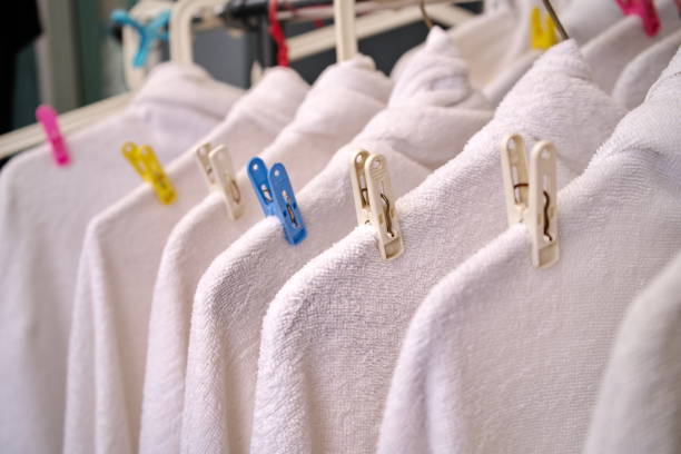 istock White Towel Hanging Drying after Washing. Clean and Soft. Laundry Shop. 1176958647