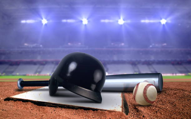 istock Baseball equipment in a stadium under bright spotlights 1176960561