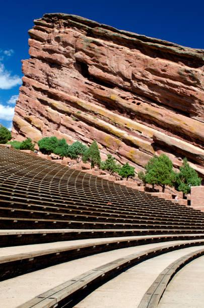 Red Rocks Colorado A massive red rock towers over a music venue in Morrison Colorado. morrison stock pictures, royalty-free photos & images