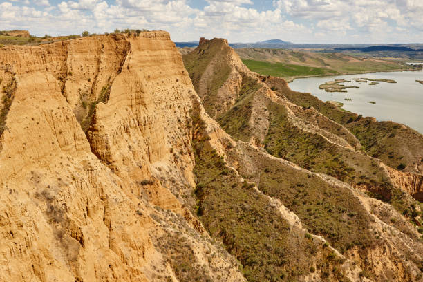 istock Red clay erosion gully and river. Eroded landscape. Spain 1176965853