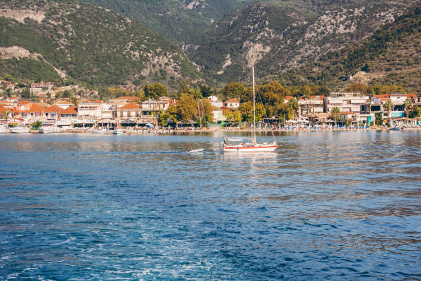 istock Small sailboat near coast 1176966118