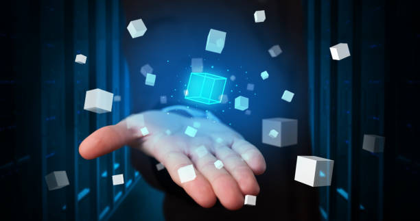 istock Person holding cube hologram projections 1176966295