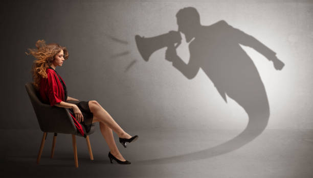 istock Dark shadow yelling to elegant lady 1176969332