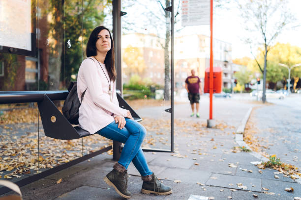 istock Young woman waiting for bus 1176969555