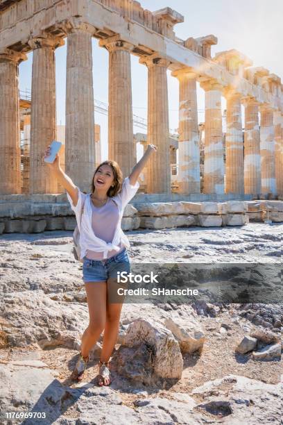 Woman Takes Selfie Pictures In Front Of The Parthenon Temple At The Acropolis Of Athens Greece Stock Photo - Download Image Now