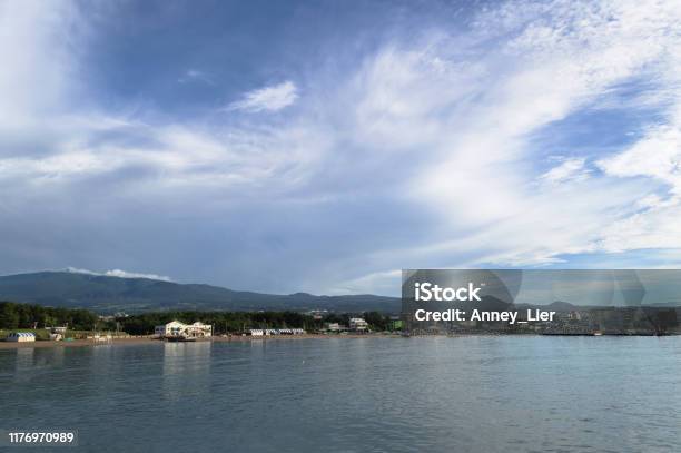 View Form Nearby Pier On Iho Tewoo Beach And Lanscape Of Jeju Island With Scenic Cloudscape Stock Photo - Download Image Now