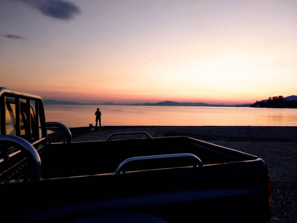 istock Silhouette of fisherman 1176971219