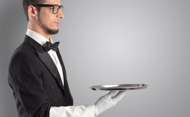 istock Waiter serving with white gloves and steel tray 1176972041