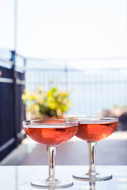 istock Two crystal stemmed glasses with rose wine 1176972378