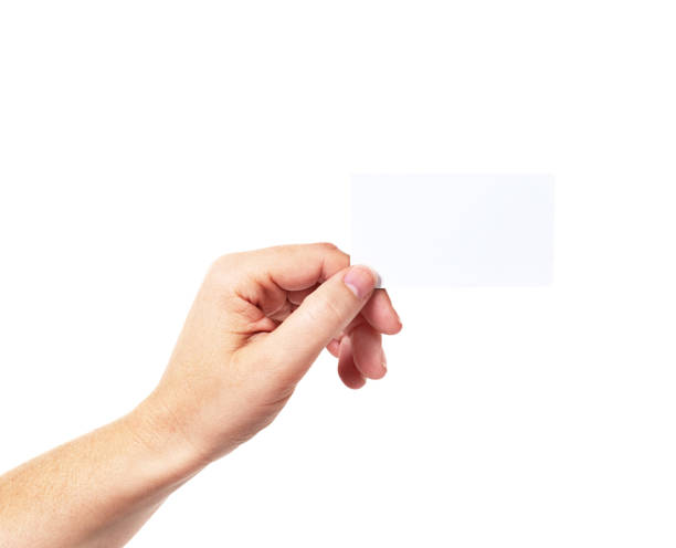 istock Hand takes blank business card against white 1176974015