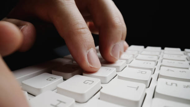 istock Close-up soft-focus finger typing on keyboard. 1176975249