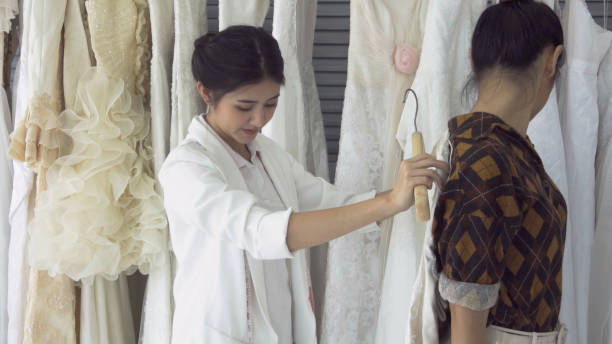 istock Future bride customer talking with wedding store shopkeeper 1176975336