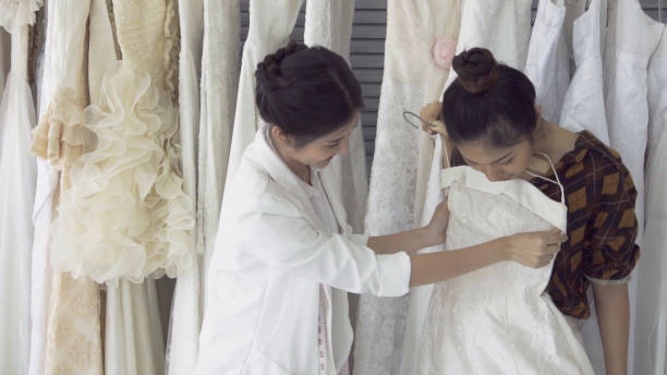 istock Future bride customer talking with wedding store shopkeeper 1176975355