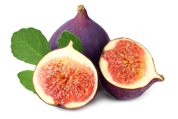 istock Fig fruit with slices and green leaf isolated on white background 1176975362