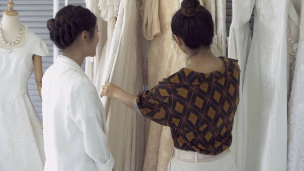 istock Future bride customer talking with wedding store shopkeeper 1176975382