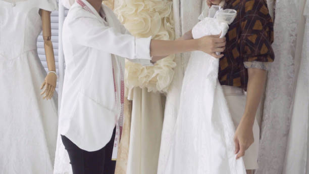 istock Future bride customer talking with wedding store shopkeeper 1176975454