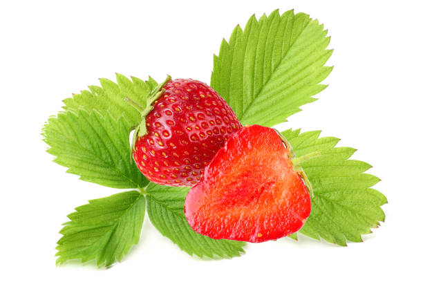 istock Sliced strawberry with green leaves isolated on a white background 1176975643