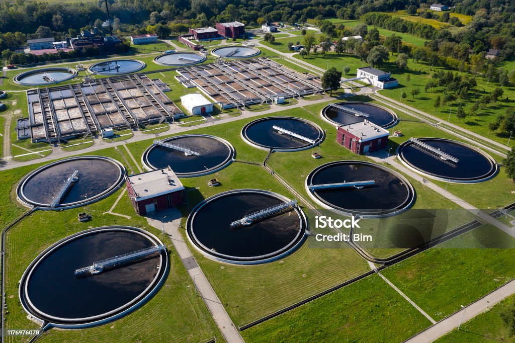 Water Purification Plant from Above Aerial view of a water purification station viewed from above. Sewage Treatment Plant Stock Photo