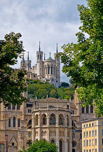 The exterior of the Notre Dame Cathedral and neighboring chapel, Lyon, France. In the foreground is the Cathedrale Saint Jean.