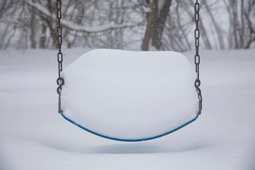 Playground equipment buried in snow during a blizzard that left over three-feet of snow in New York State.
