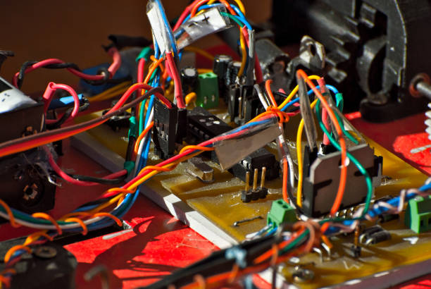 istock Electronics and robotics of handmade. Microcircuits and colored wires close up. Electronic devices and mechanisms are presented at the scientific exhibition. 1176981812