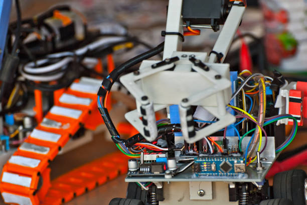 istock Electronics and robotics of handmade. Microcircuits and colored wires close up. Electronic devices and mechanisms are presented at the scientific exhibition. 1176981844