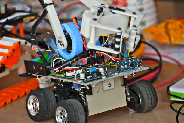 istock Electronics and robotics of handmade. Microcircuits and colored wires close up. Electronic devices and mechanisms are presented at the scientific exhibition. 1176981859