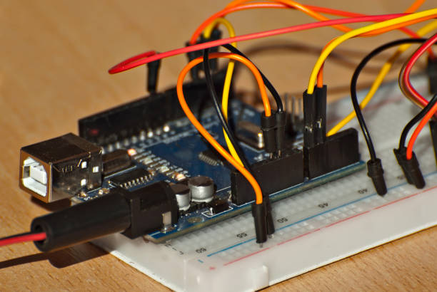 istock Electronics and robotics of handmade. Microcircuits and colored wires close up. Electronic devices and mechanisms are presented at the scientific exhibition. 1176981977