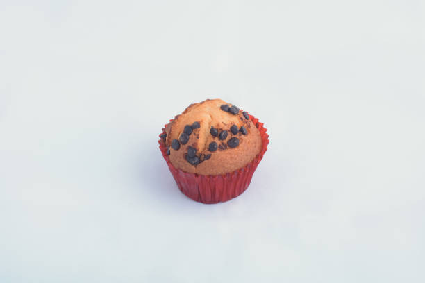 istock Chocolate chip muffin on white isolated background. 1176987255