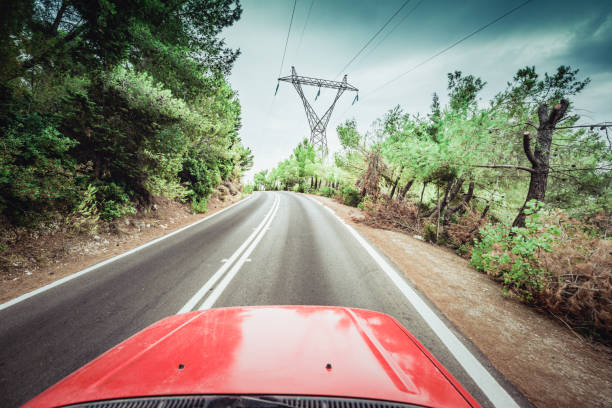istock driving car on country road 1176988897