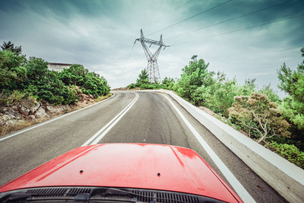 istock driving car on country road 1176988904