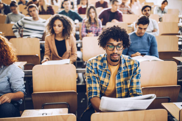 istock African American college student studying on a class at lecture hall. 1176989115