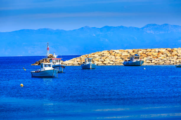 Fishing boats and mountain view in Messinia, Peloponnese, Greece
