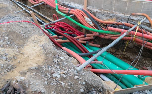 istock road work construction with many colorful tubes and pipes running through an unconvered ditch 1176991176
