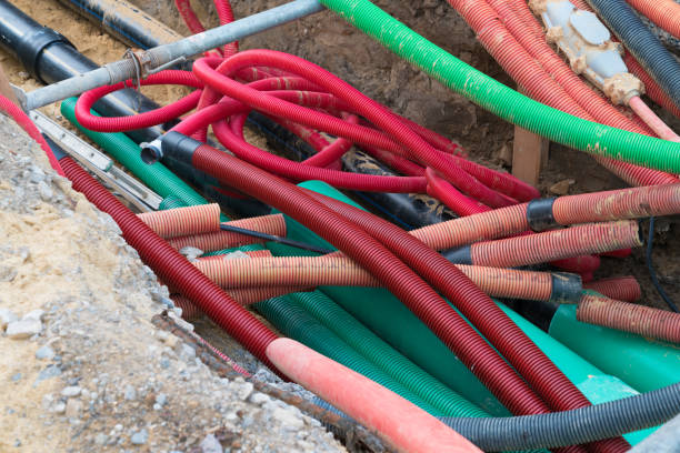 istock road work construction with many colorful tubes and pipes running through an unconvered ditch 1176991202