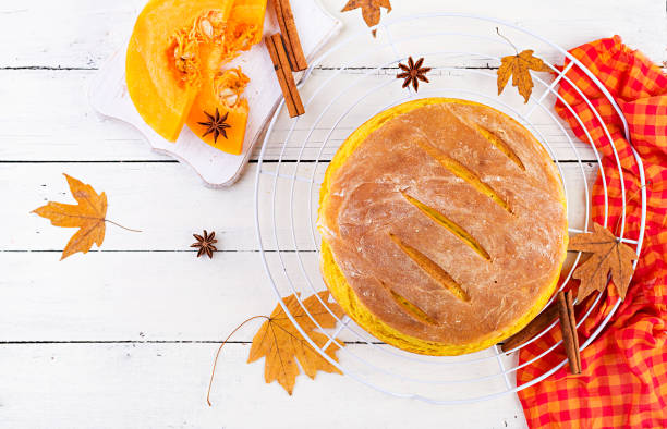 istock Fresh homemade pumpkin bread and pumpkin slices. Top view 1176994524