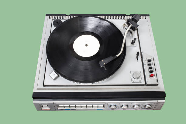 istock Vintage record player with radio tuner on green background 1176996074
