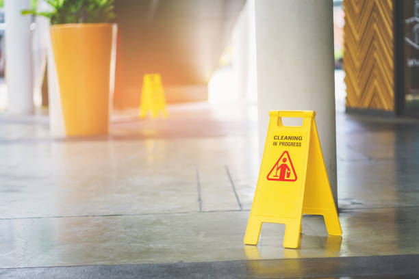 istock cleaning in progress sign on yellow plastic board on floor 1176996095