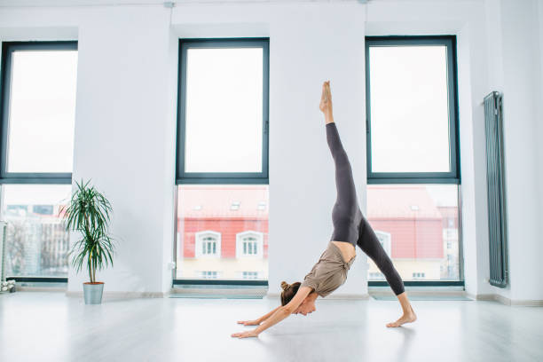 istock flexible girl doing a flip 1176999000