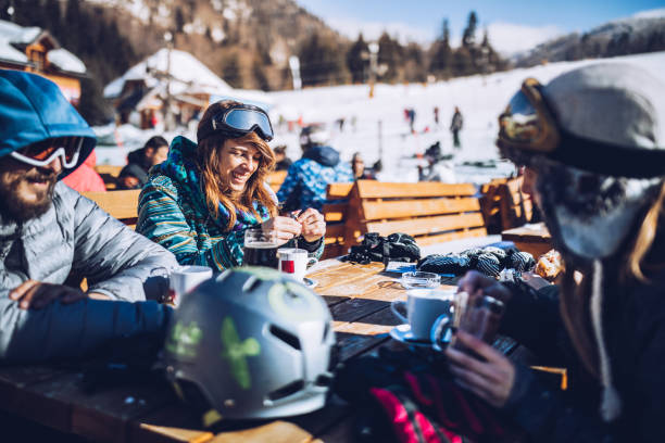 istock Young happy skiers taking a break in a cafe. 1176999251