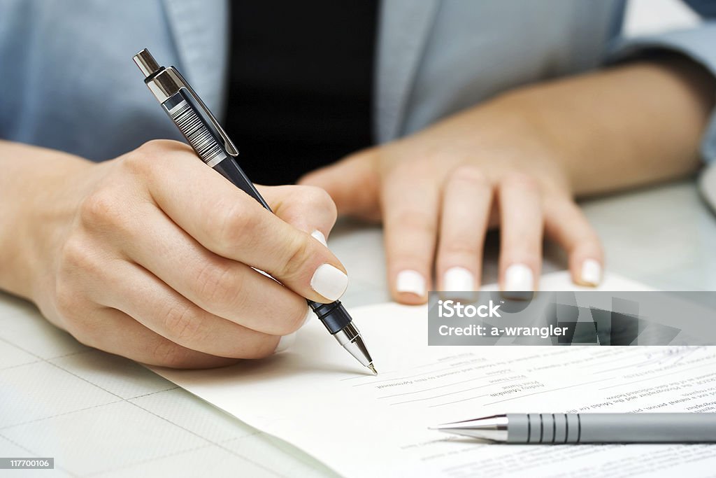Businesswoman signing contract  Adult Stock Photo