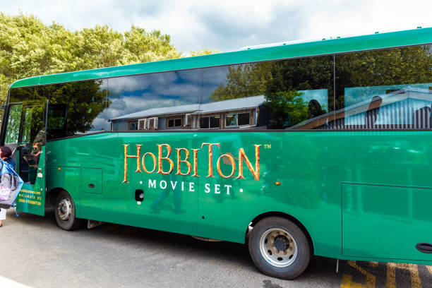 Tourist bus in Hobbiton Movie Set, Matamata, New Zealand. Tourist bus in Hobbiton Movie Set, Matamata, New Zealand matamata new zealand stock pictures, royalty-free photos & images