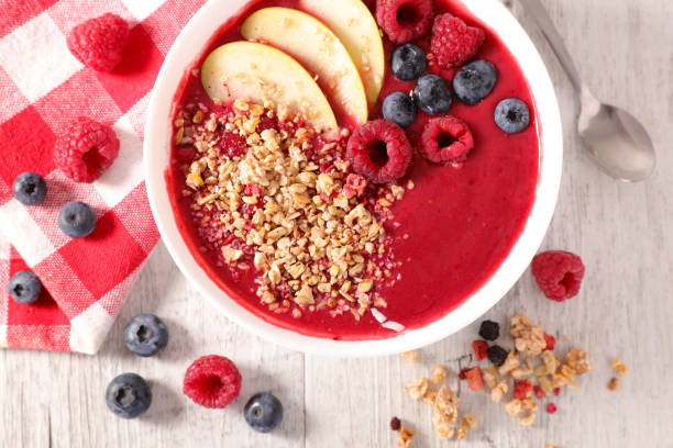 istock berry fruit smoothie with granola and fruits 1177004722