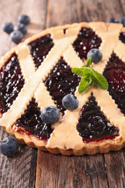 istock blueberry tart on wood bakground 1177004744