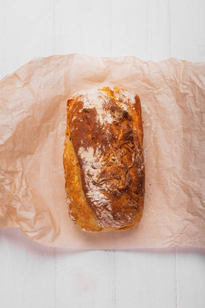 istock Homemade bread in baking paper on a white background 1177007059