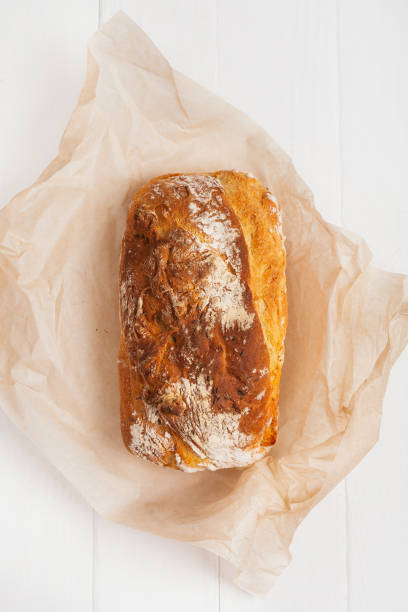 istock Homemade bread in baking paper on a white background 1177007061
