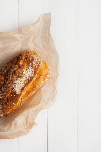 istock Homemade bread in baking paper on a white background 1177007162