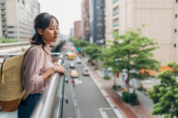 istock Woman standing on terrace 1177009431