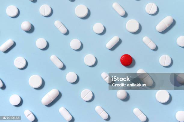 White Pills On Blue Background Stock Photo - Download Image Now - Medicine, Pill, Capsule - Medicine